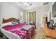 Cozy bedroom featuring a ceiling fan and a neutral-toned wall color at 419 Cierra Oaks Cir, Lady Lake, FL 32159
