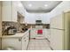 Functional kitchen with white cabinetry, a tiled backsplash, and standard appliances at 419 Cierra Oaks Cir, Lady Lake, FL 32159