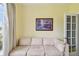 Comfortable living room featuring a cream-colored sofa and natural lighting at 419 Cierra Oaks Cir, Lady Lake, FL 32159