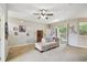Bright living room with neutral walls, ceiling fan, and access to the outdoors at 419 Cierra Oaks Cir, Lady Lake, FL 32159