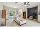Spacious living room with neutral tones, ceiling fan, and access to the backyard at 419 Cierra Oaks Cir, Lady Lake, FL 32159