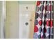 Shower stall featuring white tile and glass door at 419 Cierra Oaks Cir, Lady Lake, FL 32159