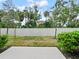 Backyard area featuring green space with a vinyl fence and trees at 463 Cape Honeysuckle Pl, Sanford, FL 32771