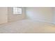 Bedroom featuring neutral carpet, with a window providing natural light at 463 Cape Honeysuckle Pl, Sanford, FL 32771