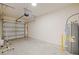 Spacious garage with a garage door opener and hot water tank at 463 Cape Honeysuckle Pl, Sanford, FL 32771