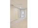 Hallway featuring neutral carpet and ample lighting, leading to other rooms at 463 Cape Honeysuckle Pl, Sanford, FL 32771