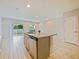 Modern kitchen island featuring granite countertops, stainless steel dishwasher, and an open floorplan at 463 Cape Honeysuckle Pl, Sanford, FL 32771