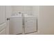 Bright laundry room with included white washer and dryer and tile floors at 463 Cape Honeysuckle Pl, Sanford, FL 32771