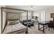 Bedroom with a four-poster bed, a desk area and good natural lighting at 5065 Sparkling Water Way, Kissimmee, FL 34746