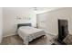 Well lit bedroom featuring ocean themed artwork, a bed, and a large window at 5065 Sparkling Water Way, Kissimmee, FL 34746
