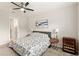 Bright main bedroom with ceiling fan, neutral tones, and ensuite bathroom access at 5065 Sparkling Water Way, Kissimmee, FL 34746