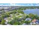 Scenic aerial shot of lakeside property surrounded by trees, showcasing the community's location at 6317 Cheryl St, Orlando, FL 32819