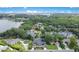 Stunning aerial view of lakefront homes surrounded by lush greenery and a beautiful lake at 6317 Cheryl St, Orlando, FL 32819