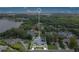 Aerial shot of the property showcasing its prime location near the lake and lush greenery at 6317 Cheryl St, Orlando, FL 32819