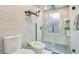 Modern bathroom featuring a toilet and bidet, and walk-in shower with frosted glass at 6317 Cheryl St, Orlando, FL 32819