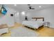 Bright bedroom featuring a ceiling fan, simple decor, and an area rug at 6317 Cheryl St, Orlando, FL 32819