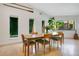 Charming dining area with natural light, modern decor, and views of the outdoor greenery at 6317 Cheryl St, Orlando, FL 32819