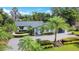 Charming single-story home featuring a lush landscaped yard, modern design, and inviting curb appeal at 6317 Cheryl St, Orlando, FL 32819