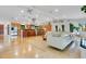 Open-concept living space featuring polished floors, modern lighting, and a spacious kitchen area at 6317 Cheryl St, Orlando, FL 32819