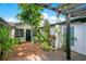 An outdoor space with tropical landscaping provides an inviting ambiance for relaxation and entertainment at 6317 Cheryl St, Orlando, FL 32819