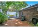 Cozy outdoor patio features stone accents and lush tropical landscaping, creating an inviting and serene outdoor living space at 6317 Cheryl St, Orlando, FL 32819