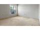 Bedroom featuring a window with blinds, neutral walls and carpet at 708 Duffer Ln, Kissimmee, FL 34759