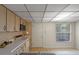 Kitchen showcasing wood cabinets, white countertops, and a tile backsplash at 708 Duffer Ln, Kissimmee, FL 34759