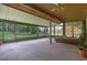 Bright and spacious screened porch with hot tub and view of the backyard at 708 Duffer Ln, Kissimmee, FL 34759