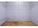 Empty walk-in closet providing organized storage solutions with wire shelves at 708 Duffer Ln, Kissimmee, FL 34759