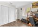 Bright bedroom featuring a window, closet space, and wood-look floors at 7421 Sugar Bend Dr # 7421, Orlando, FL 32819