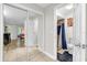 Hallway leading to a bathroom with a shower and a bedroom with mirrored closet doors at 7421 Sugar Bend Dr # 7421, Orlando, FL 32819