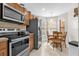 Bright eat-in kitchen with stainless steel appliances, oak cabinets and lots of natural light at 7421 Sugar Bend Dr # 7421, Orlando, FL 32819