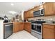 Well-equipped kitchen with stainless steel appliances, granite countertops, and ample cabinet space at 7421 Sugar Bend Dr # 7421, Orlando, FL 32819