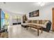 Spacious living room with neutral tones, tile floors, and lots of natural light at 7421 Sugar Bend Dr # 7421, Orlando, FL 32819