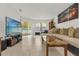 Bright living room with a large sectional sofa, tile floors, and a view of the outdoors at 7421 Sugar Bend Dr # 7421, Orlando, FL 32819