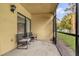 Cozy screened patio with comfortable seating, perfect for relaxing outdoors at 7421 Sugar Bend Dr # 7421, Orlando, FL 32819