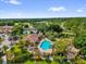 Community swimming pool and clubhouse surrounded by landscaped gardens at 7421 Sugar Bend Dr # 7421, Orlando, FL 32819