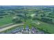 Aerial view of a community, golf course, and winding walking trails at 9069 Pinch Shot Dr, Winter Garden, FL 34787