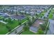 Aerial view of a neighborhood featuring houses, green lawns, a playground, and a covered picnic area at 9069 Pinch Shot Dr, Winter Garden, FL 34787