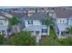 Two-story home with a charming facade, solar panels and landscaping at 9069 Pinch Shot Dr, Winter Garden, FL 34787