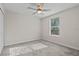 Bright bedroom with neutral colors, ceiling fan and carpet at 9069 Pinch Shot Dr, Winter Garden, FL 34787