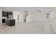 Open-concept living space with kitchen, dining, and living area and tile flooring at 9069 Pinch Shot Dr, Winter Garden, FL 34787