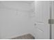 Walk-in closet featuring a clothing rack, base molding and soft carpet at 9069 Pinch Shot Dr, Winter Garden, FL 34787