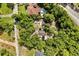 Overhead view of a home with a pool and backyard surrounded by lush greenery at 9536 Peer Dr, Orlando, FL 32817