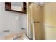 This bathroom has a medicine cabinet, shower with curtain, and a vanity with sink at 9536 Peer Dr, Orlando, FL 32817
