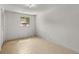 Empty bedroom featuring laminate flooring and a window that provides natural light at 9536 Peer Dr, Orlando, FL 32817