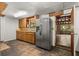 Kitchen featuring wood cabinets, laminate countertops and stainless steel fridge at 9536 Peer Dr, Orlando, FL 32817