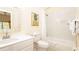 Bathroom featuring a sink, toilet, mirror, and a bathtub at 1109 New Providence # 141109, Davenport, FL 33897