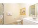 Bright bathroom featuring a toilet, sink, mirror, and a shower at 1109 New Providence # 141109, Davenport, FL 33897