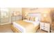 Bedroom featuring a dresser, mirror, closet and bedside tables at 1109 New Providence # 141109, Davenport, FL 33897